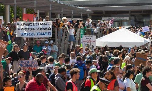 Climate activisists with science banner at protest